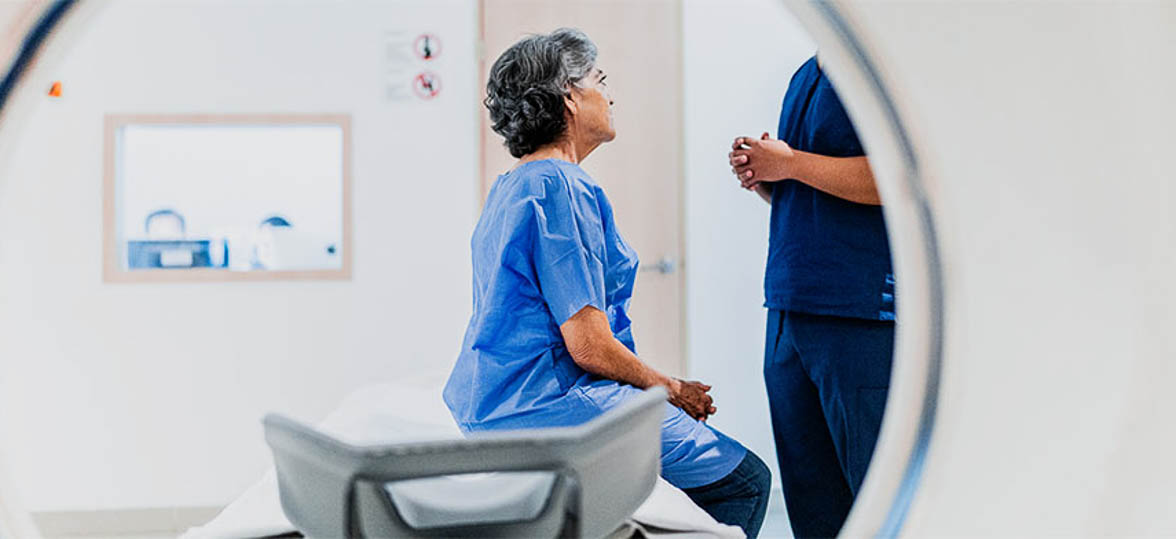 View of a patient sitting at a CT scan machine