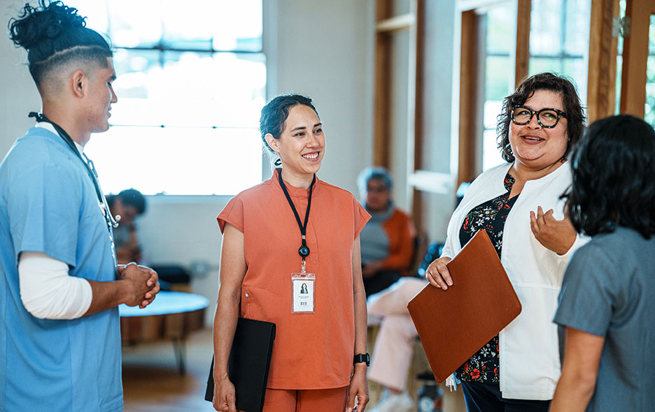 a group of healthcare workers discussing treatment plans