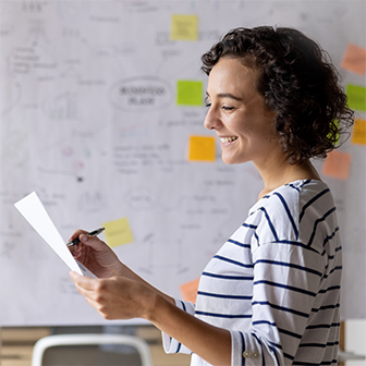 a young business woman working on a business plan