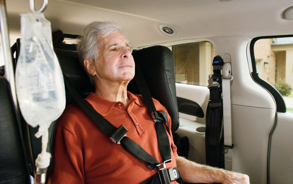 Man in Traversa Chair Inside a Van.