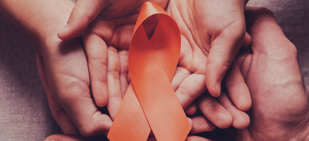 Hands holding an ADHD awareness ribbon